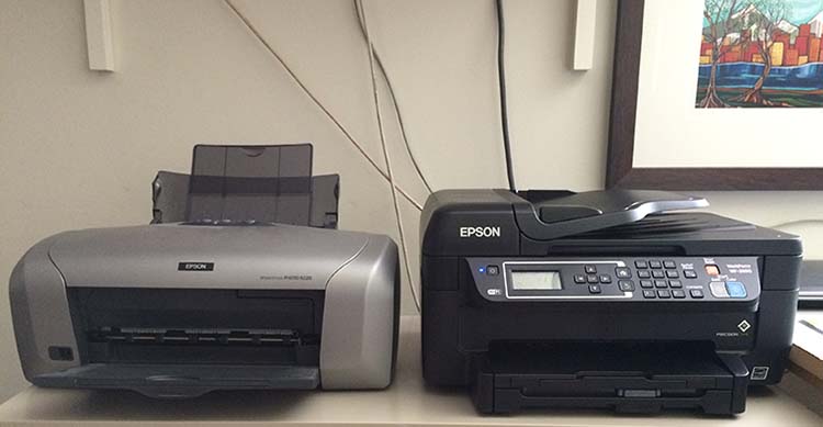 Picture of my old Epson R220 and my new Epson WF-2650 printer